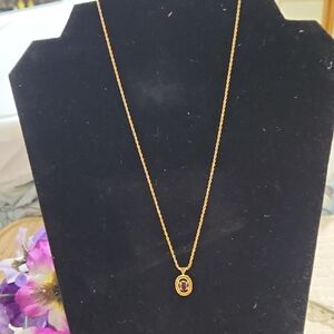 Elegant Gold Necklace with Purple Pendant